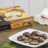 Hawaiian Host "Maui Caramacs" Chocolate & Caramel Macadamia Nuts arranged on serving tray