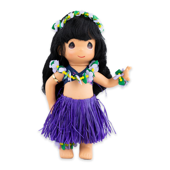 Doll with purple skirt and floral leis around her head, neck, and wrist