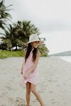 Hat being worn on the beach