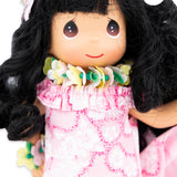 Close up of the floral lei that the doll is wearing