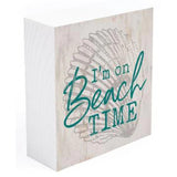 Wooden Block with a seashell and writing over it that says "I'm on Beach Time"