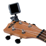 Kala Klipz Gray Rechargeable Tuner on ukulele headstock.