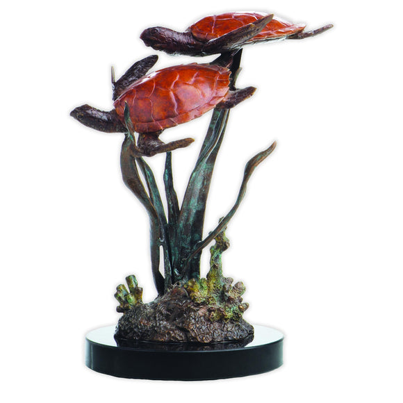 Figurine with two red-shelled turtles swimming amongst coral reefs