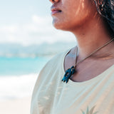 Model wearing Pacific Ocean Collections Buffalo Horn Honu (Sea Turtle) Necklace