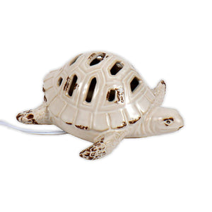 Ceramic Sea Turtle with cord come from the back of it to plug into the wall (For the light feature to work)