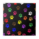 Square trivet designed with colorful dog paws.