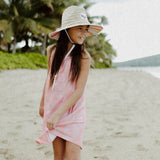 Little girl wearing Reign + Skye Sun Kissed Stripes Straw Hat