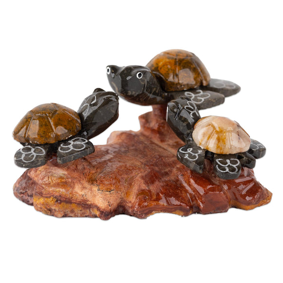 Three turtles on a rock. Hand carved and with nice colors