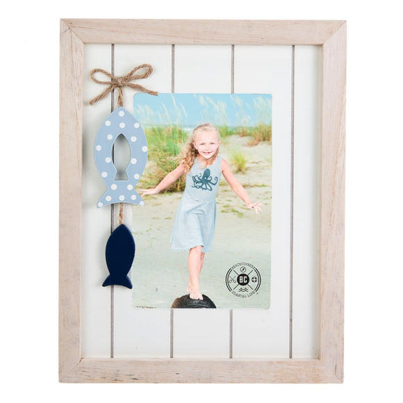 Wooden Frame with two hanging fish inside of the frame to give it an ocean-side theme