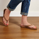 Model wearing OluKai "Aukai" Women's Sandals- Tan/Tan