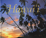 Book of Hawaii with bright sunset and tropical trees