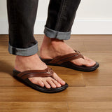 Model wearing OluKai Men's "Mea Olu" Sandals- Tan/Dark Java