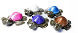 Carved turtles with bright shells that give off a metallic look